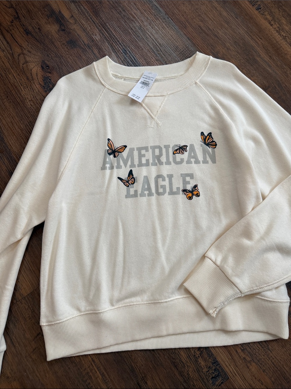 American Eagle Outfitters Cream Crewneck with Orange Butterfly Accents
